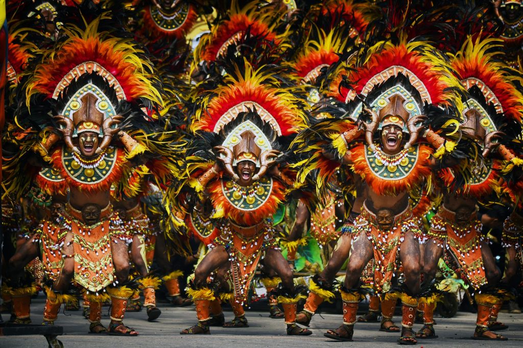 Street dancers in colorful costumes at Philippine festival